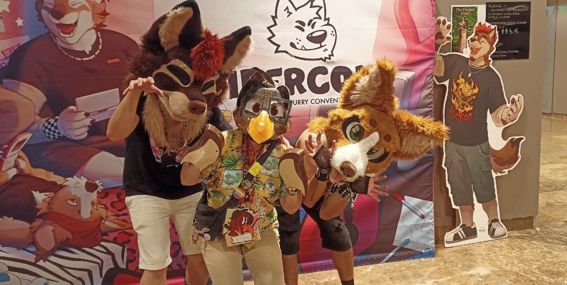 A picture of me in fursuit next to the Ibercon mascots